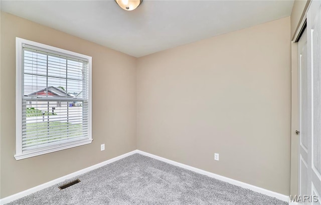 628 Meadowgreen Dr, Troy, MO 63379 - spare room featuring baseboards and carpet floors