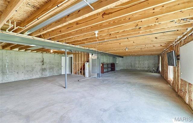 628 Meadowgreen Dr, Troy, MO 63379 - unfinished below grade area with water heater, stairs, and heating unit