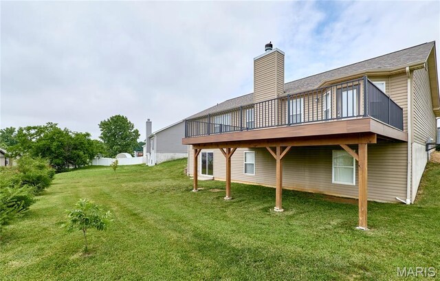 628 Meadowgreen Dr, Troy, MO 63379 - rear view of property with a lawn, a wooden deck, and a chimney