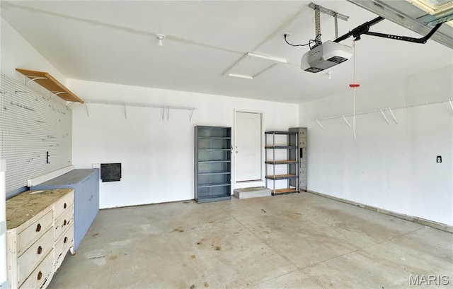 628 Meadowgreen Dr, Troy, MO 63379 - garage featuring a garage door opener
