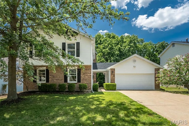 3644 Cinnamon Tree Ln, Oakville, MO 63129 - view of front of home with brick siding, a garage, concrete driveway, and a front yard