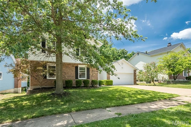 3644 Cinnamon Tree Ln, Oakville, MO 63129 - view of front of home with brick siding, a front yard, and concrete driveway
