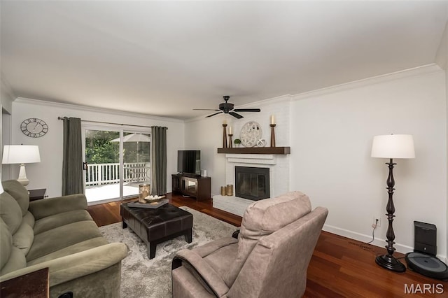 3644 Cinnamon Tree Ln, Oakville, MO 63129 - living room featuring ceiling fan, wood finished floors, ornamental molding, and a brick fireplace