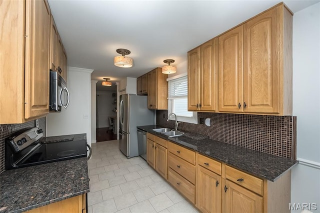 3644 Cinnamon Tree Ln, Oakville, MO 63129 - kitchen featuring appliances with stainless steel finishes, tasteful backsplash, dark stone counters, and light tile patterned flooring
