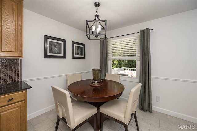 3644 Cinnamon Tree Ln, Oakville, MO 63129 - dining area with a chandelier and light tile patterned floors