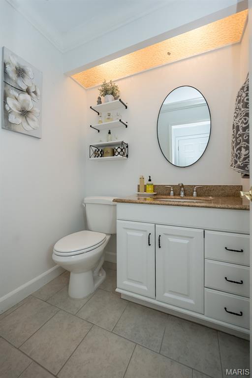 3644 Cinnamon Tree Ln, Oakville, MO 63129 - bathroom with vanity and tile patterned floors