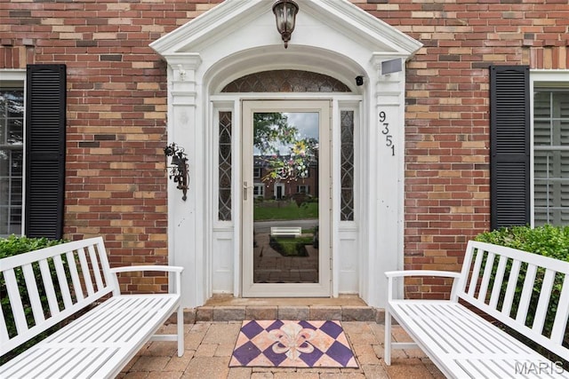 9351 White Ave, Brentwood, MO 63144 - view of exterior entry with brick siding and a porch