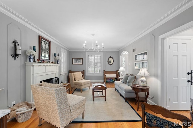 9351 White Ave, Brentwood, MO 63144 - living area with ornamental molding, wood finished floors, a chandelier, and a fireplace