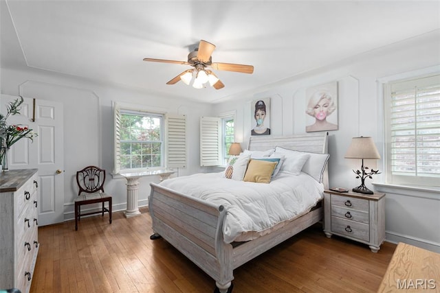 9351 White Ave, Brentwood, MO 63144 - bedroom with hardwood / wood-style flooring and a ceiling fan