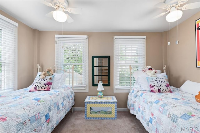 9351 White Ave, Brentwood, MO 63144 - carpeted bedroom featuring multiple windows, baseboards, and ceiling fan