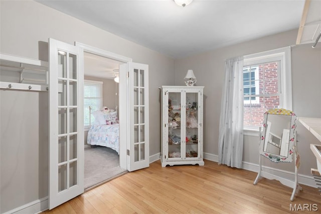 9351 White Ave, Brentwood, MO 63144 - office featuring hardwood / wood-style floors, french doors, and baseboards