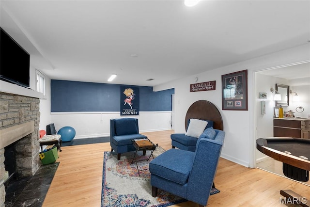 9351 White Ave, Brentwood, MO 63144 - living area featuring a fireplace and wood finished floors
