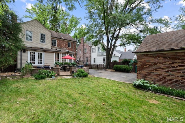9351 White Ave, Brentwood, MO 63144 - back of property with french doors and a patio