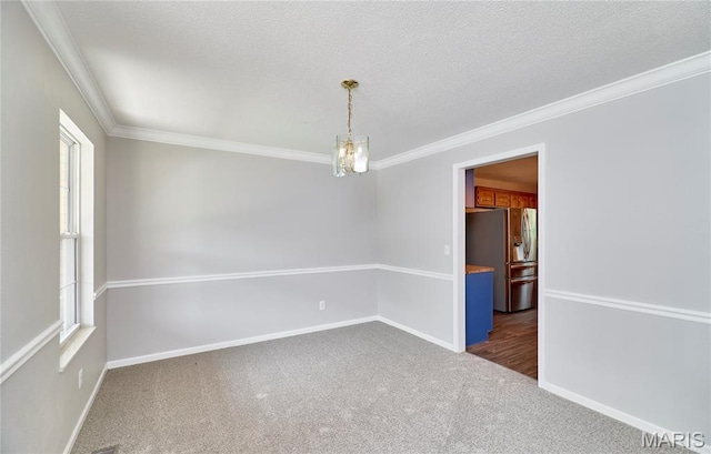 1583 Clarys Grv, Ofallon, IL 62269 - empty room with dark colored carpet, crown molding, and baseboards