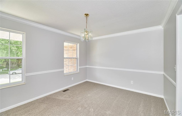 1583 Clarys Grv, Ofallon, IL 62269 - carpeted empty room featuring a chandelier, ornamental molding, baseboards, and a textured ceiling