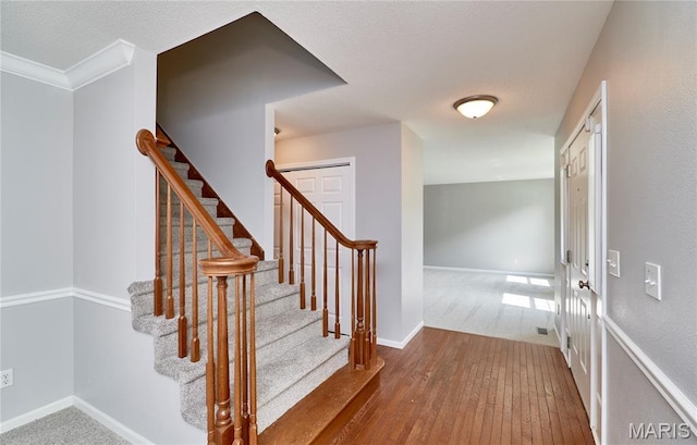 1583 Clarys Grv, Ofallon, IL 62269 - stairs with wood-type flooring and baseboards