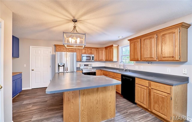 1583 Clarys Grv, Ofallon, IL 62269 - kitchen with stainless steel appliances, a sink, dark wood-type flooring, a chandelier, and recessed lighting