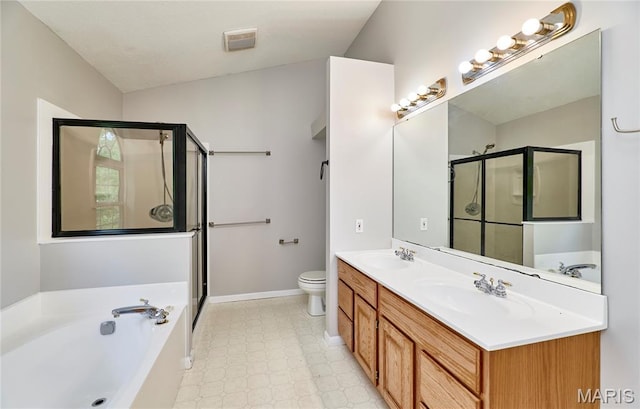 1583 Clarys Grv, Ofallon, IL 62269 - bathroom with a stall shower, double vanity, a garden tub, baseboards, and toilet