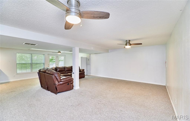 1583 Clarys Grv, Ofallon, IL 62269 - carpeted living room with a textured ceiling, baseboards, and ceiling fan