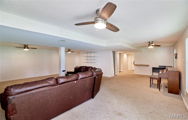 1583 Clarys Grv, Ofallon, IL 62269 - living room featuring a textured ceiling, light carpet, baseboards, and a ceiling fan