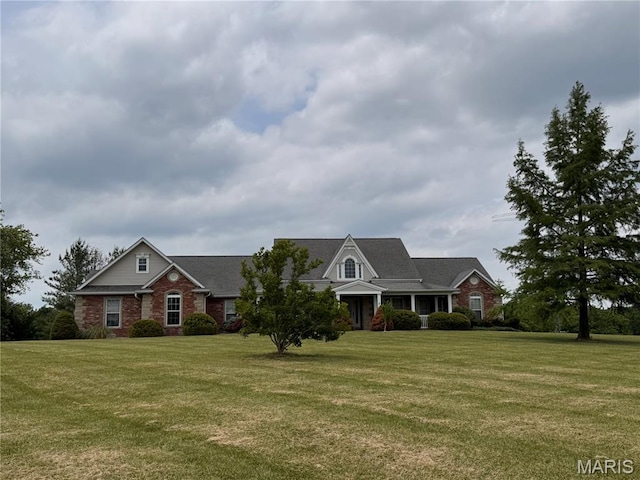 5 Ashley Ln, Hawk Point, MO 63349 - view of front of house featuring a front lawn and brick siding