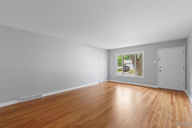6714 Sandy Hill Dr, Hazelwood, MO 63042 - spare room featuring light wood-type flooring and baseboards