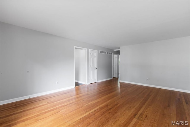 6714 Sandy Hill Dr, Hazelwood, MO 63042 - unfurnished room featuring wood finished floors and baseboards