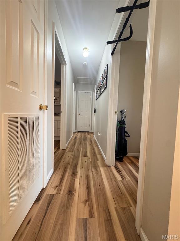 1319 W Church St, Bowling Green, MO 63334 - hall featuring light wood-style flooring and baseboards
