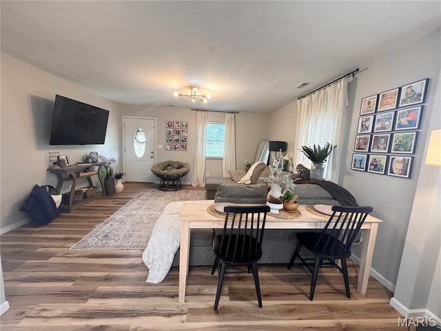 1319 W Church St, Bowling Green, MO 63334 - dining space featuring wood finished floors and baseboards