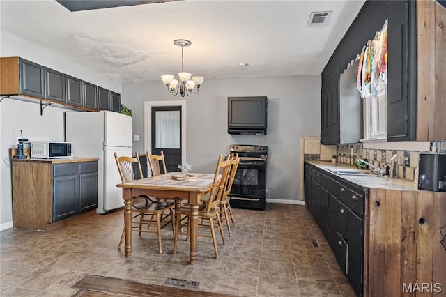 330 Elliott Ave, Chaffee, MO 63740 - dining area featuring a chandelier and baseboards