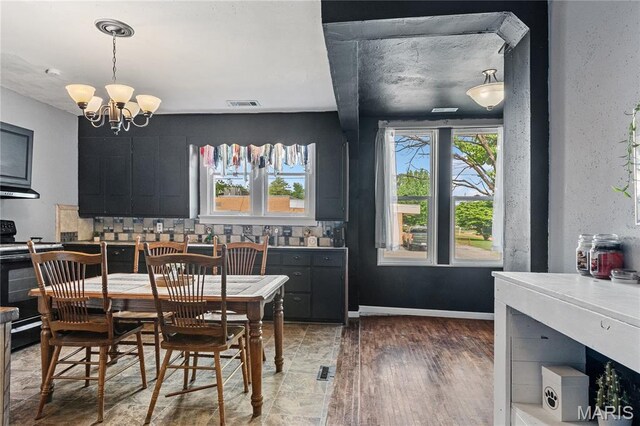 330 Elliott Ave, Chaffee, MO 63740 - dining space featuring a chandelier and light wood finished floors