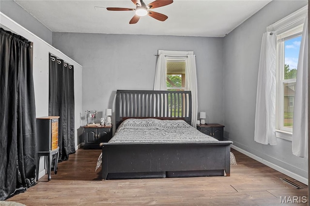 330 Elliott Ave, Chaffee, MO 63740 - bedroom with wood finished floors, baseboards, and ceiling fan
