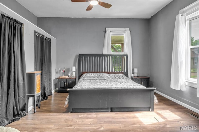 330 Elliott Ave, Chaffee, MO 63740 - bedroom with wood finished floors, baseboards, and a ceiling fan