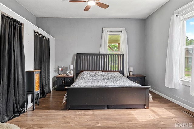 330 Elliott Ave, Chaffee, MO 63740 - bedroom featuring wood finished floors, baseboards, and a ceiling fan