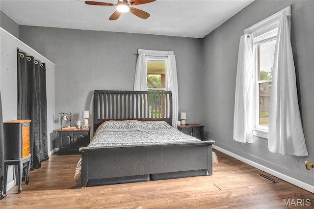 330 Elliott Ave, Chaffee, MO 63740 - bedroom featuring wood finished floors, baseboards, and a ceiling fan