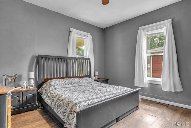 330 Elliott Ave, Chaffee, MO 63740 - bedroom with wood finished floors and baseboards
