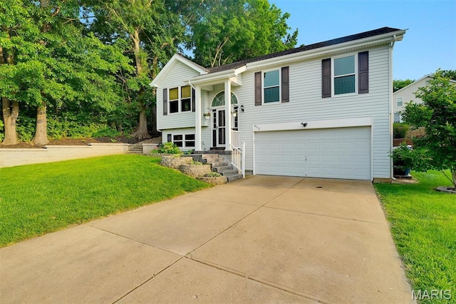 612 Hill Dr, Eureka, MO 63025 - raised ranch featuring a garage, a front lawn, and driveway