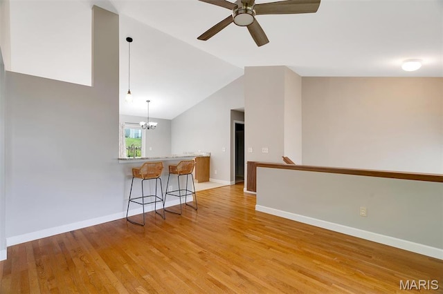 612 Hill Dr, Eureka, MO 63025 - unfurnished room featuring a chandelier, vaulted ceiling, light wood finished floors, and ceiling fan
