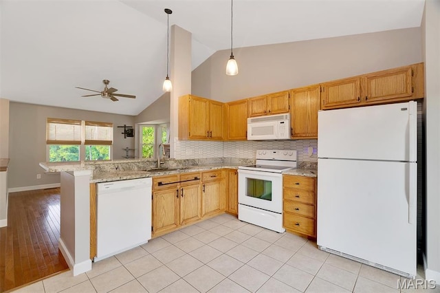612 Hill Dr, Eureka, MO 63025 - kitchen with white appliances, tasteful backsplash, a ceiling fan, light stone counters, and a peninsula