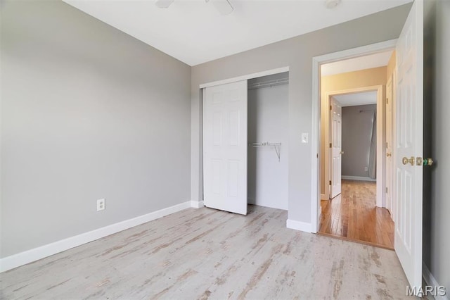 612 Hill Dr, Eureka, MO 63025 - unfurnished bedroom with wood finished floors, a closet, and ceiling fan