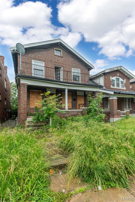 5104 Thekla Ave, Saint Louis, MO 63115 - rear view of property with brick siding