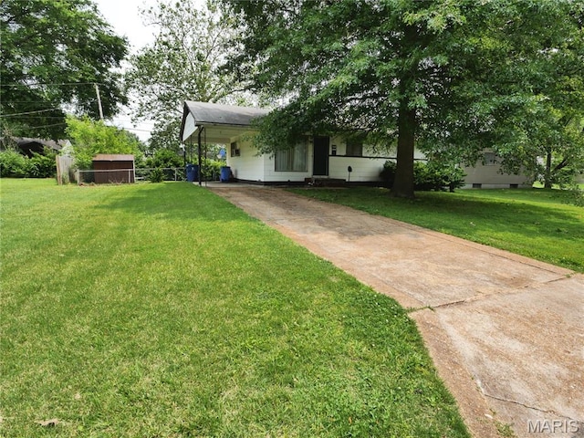 715 Tyson Dr, Florissant, MO 63031 - view of grassy yard featuring driveway and an attached carport