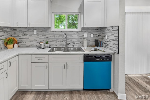 2012 Maple Tree Ln, Cahokia, IL 62206 - kitchen with dishwashing machine, a sink, and white cabinets