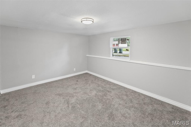 2012 Maple Tree Ln, Cahokia, IL 62206 - carpeted spare room featuring baseboards and a textured ceiling