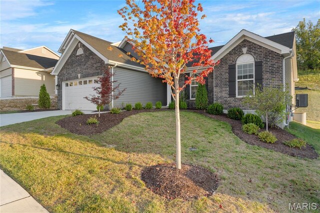 7405 Shadow Point Dr, Saint Louis, MO 63129 - view of front of home with an attached garage, a front lawn, concrete driveway, and brick siding