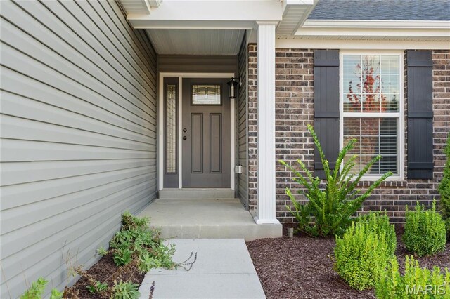 7405 Shadow Point Dr, Saint Louis, MO 63129 - doorway to property with brick siding and a shingled roof