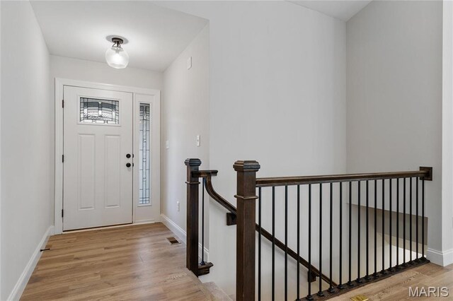 7405 Shadow Point Dr, Saint Louis, MO 63129 - entryway with wood finished floors and baseboards