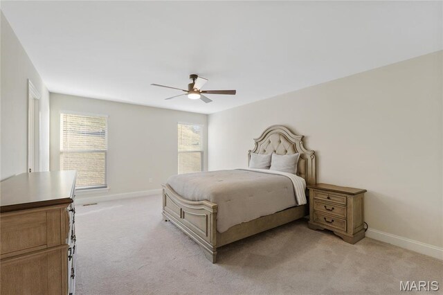 7405 Shadow Point Dr, Saint Louis, MO 63129 - bedroom featuring light carpet, baseboards, and ceiling fan