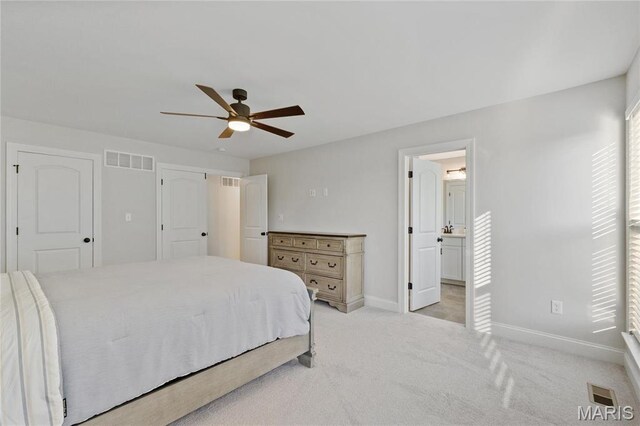 7405 Shadow Point Dr, Saint Louis, MO 63129 - bedroom featuring baseboards, light colored carpet, ceiling fan, and ensuite bathroom