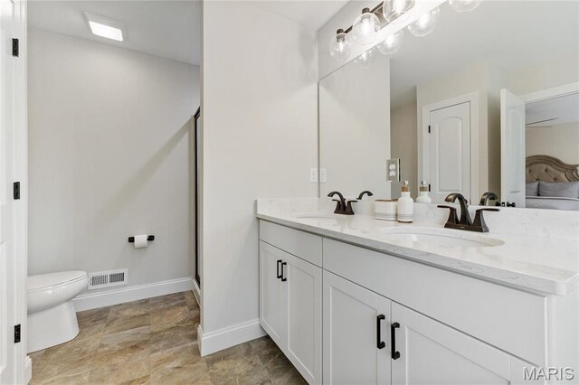 7405 Shadow Point Dr, Saint Louis, MO 63129 - bathroom featuring double vanity, baseboards, toilet, a shower stall, and connected bathroom